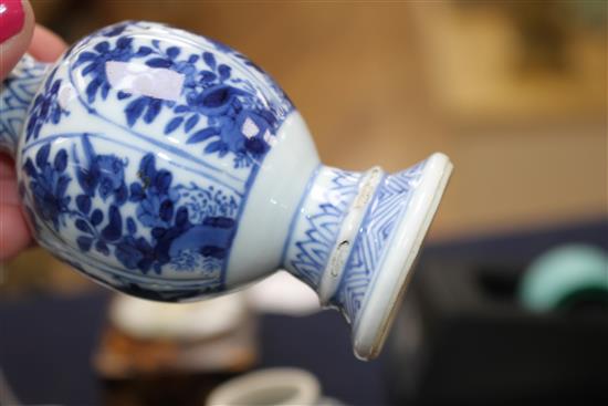 A Chinese blue and white tea bowl and saucer and two jars, Kangxi, some damage, largest diameter 11cm